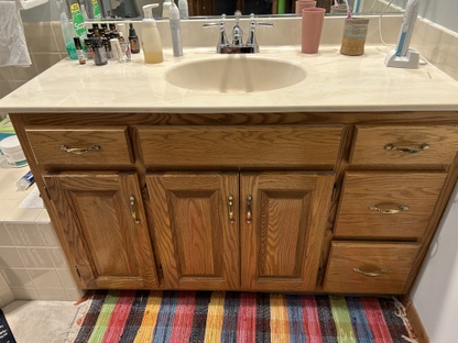EFORE: Master bath vanity with one sink.