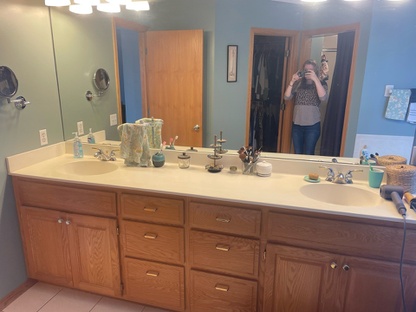 EFORE: Master bath vanity with one sink.