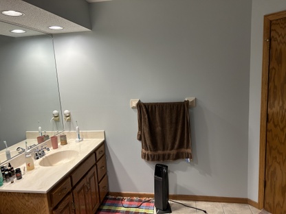 EFORE: Master bath vanity with one sink.