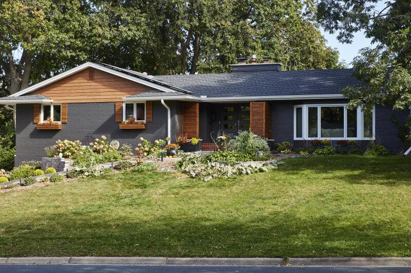 Exterior remodel by Murphy Bros. Design Build Remodel utilizes paint, siding, and custom woodwork to create outstanding curb appea.