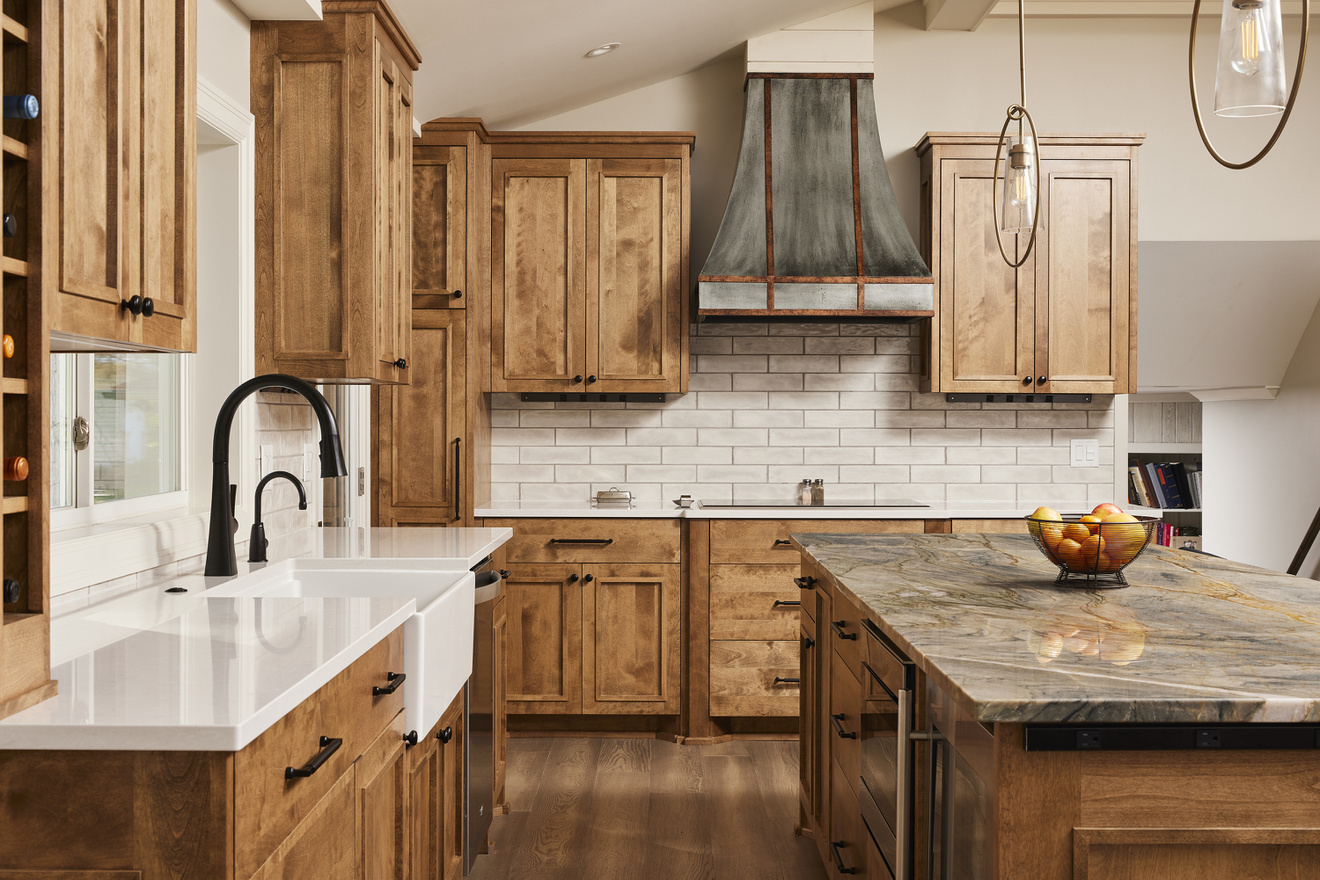 Murphy Bros. Fall 2023 Showcase kitchen with farm sink and Tempest Quartzite island countertop 