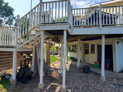 Before image of living room just off of deck entrance