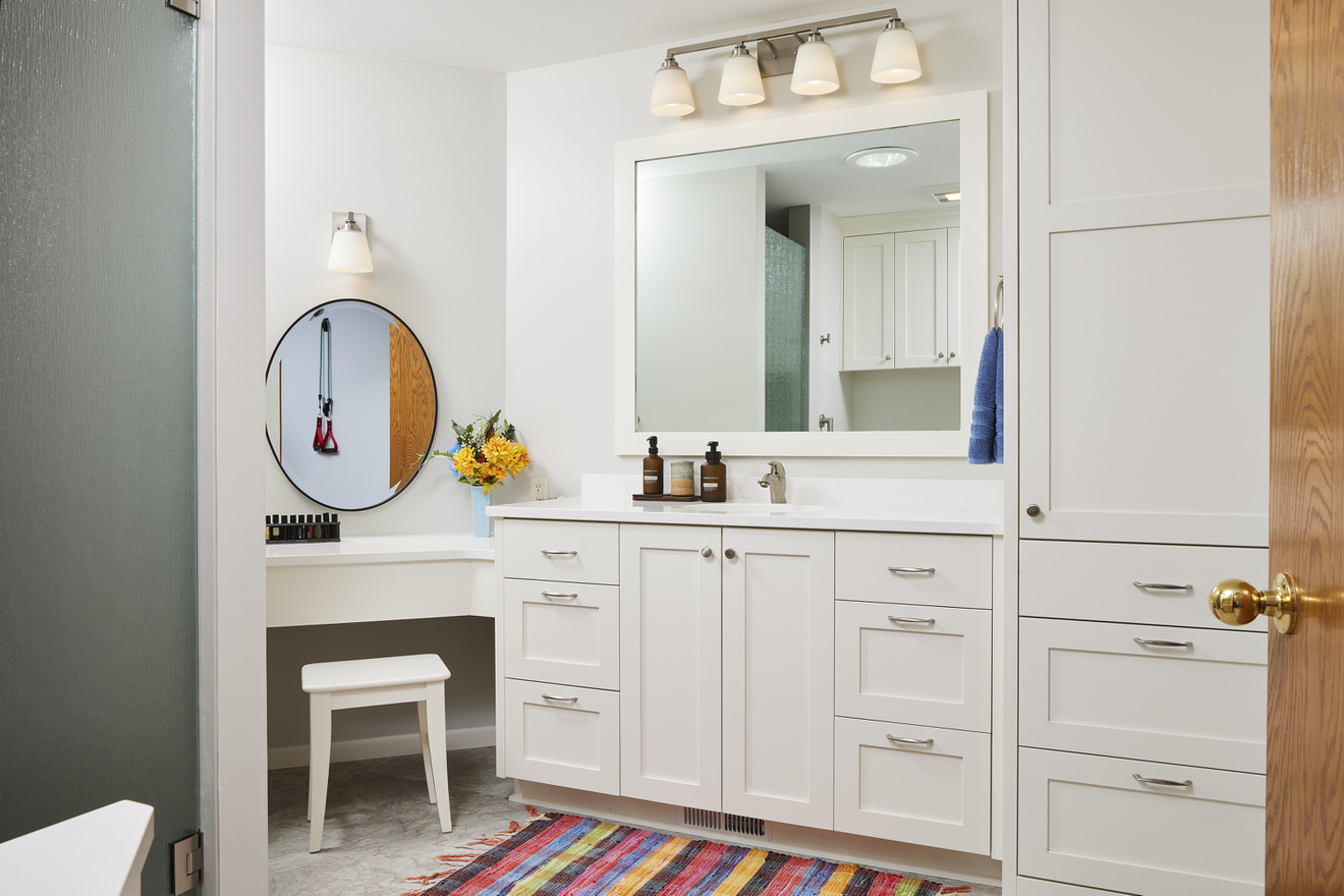 AFTER: Custom vanity with full-length mirror and dual sink.